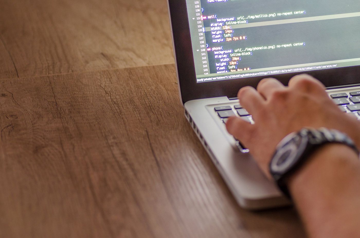 A developer building and testing software on a laptop