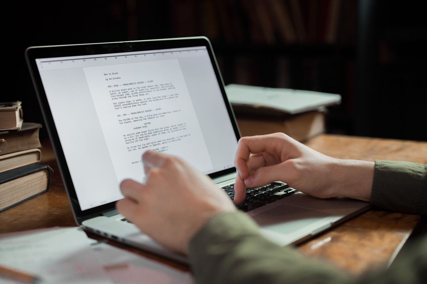 A writer drafting content on a laptop